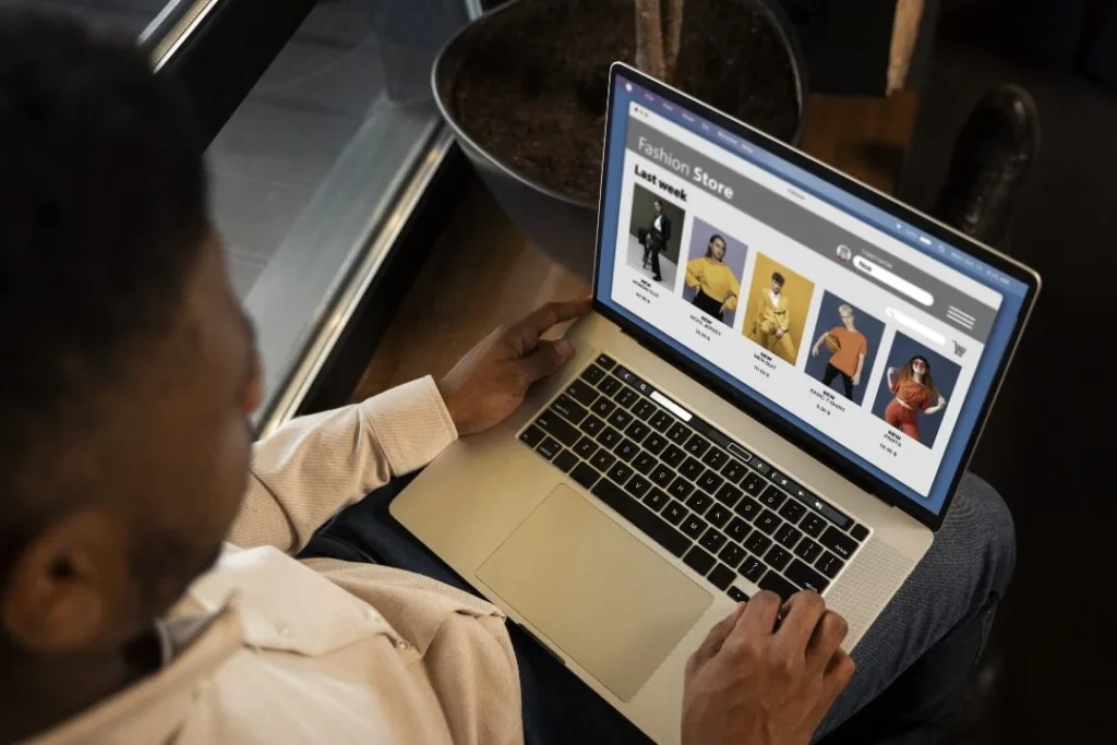 man shopping with laptop on an ecommerce website